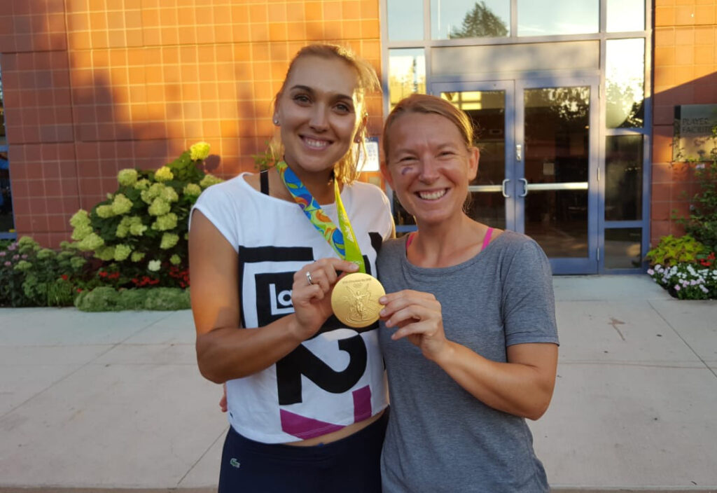 Elena Sergeyevena Vesnina and Kirstin Bauer with Olympic Gold Medal in hand