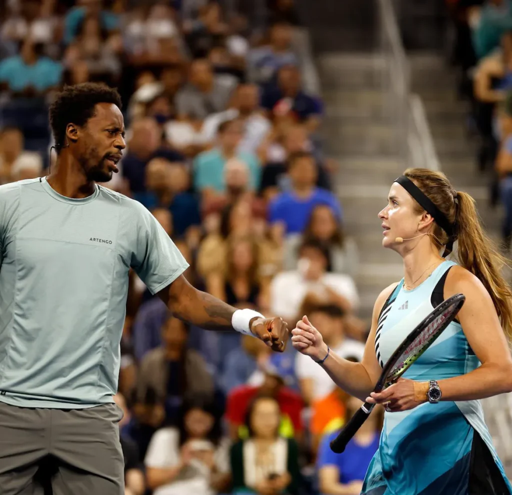Elina Switolina and Gael Monfils clap during the tournament